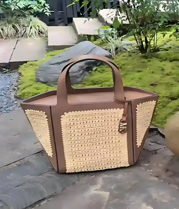 Custom fiberglass handbag sculpture, oversized woven bag statue for retail display by custom fiberglass sculpture manufacturer